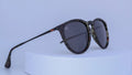 Sunglasses with tortoiseshell patterned frame on a white background