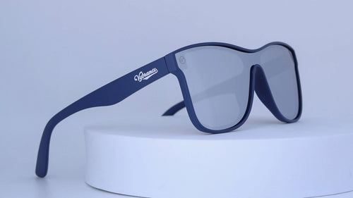 Blue sunglasses with Vybrance logo on a white background
