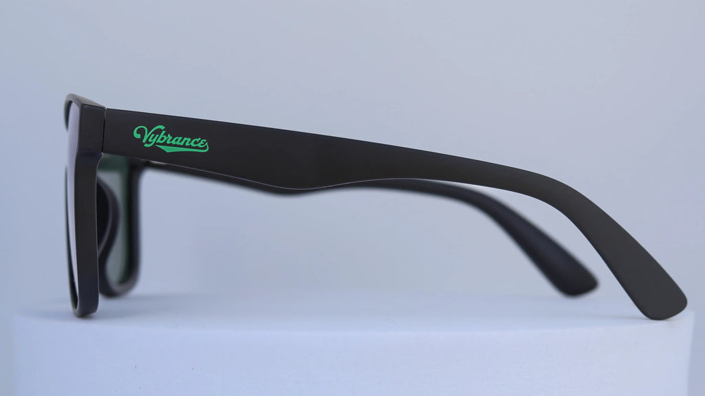 Black sunglasses with a visible brand logo on a white background
